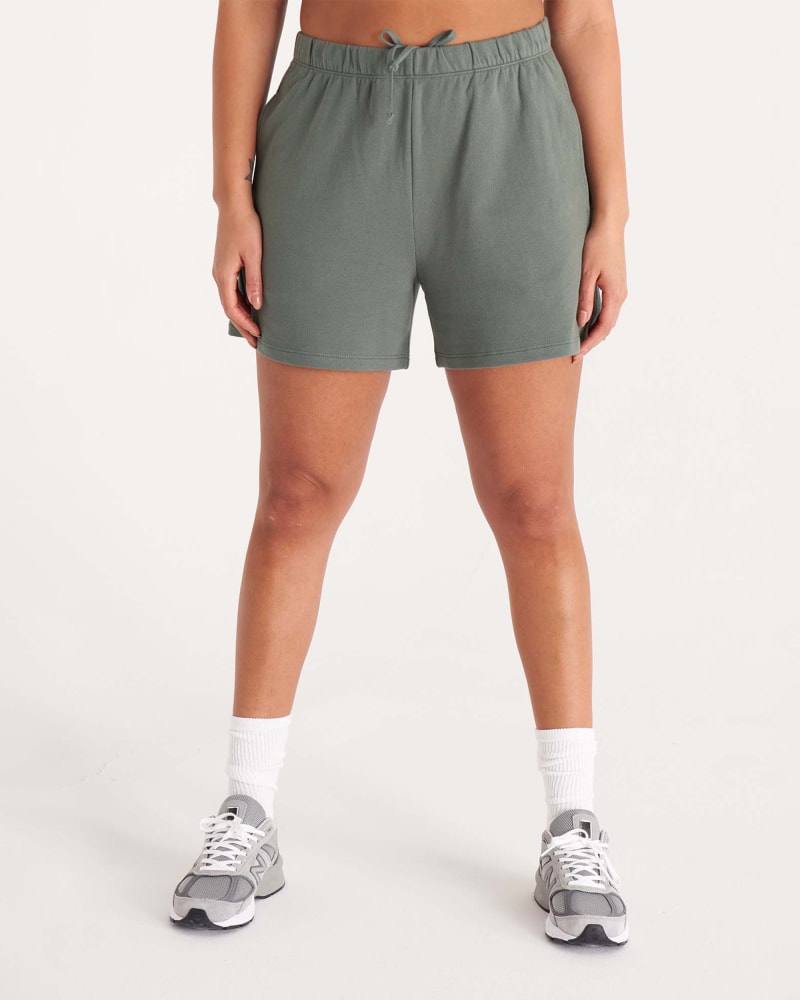 Front of a model wearing a size 5X The Sweat Short in Thyme by The Standard Stitch. | dia_product_style_image_id:304931